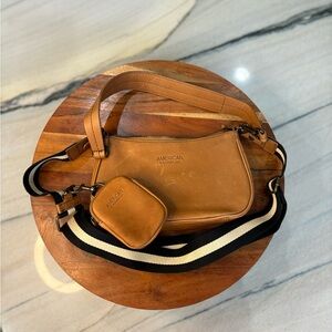 American leather small bag with crossbody and shoulder strap.